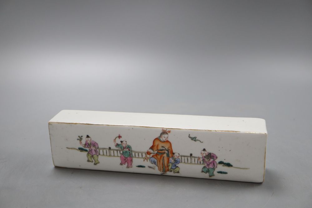 A Chinese famille rose scroll weight, length 21cm